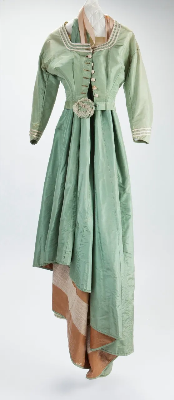 A ball gown in a shade of emerald, mid-nineteenth century